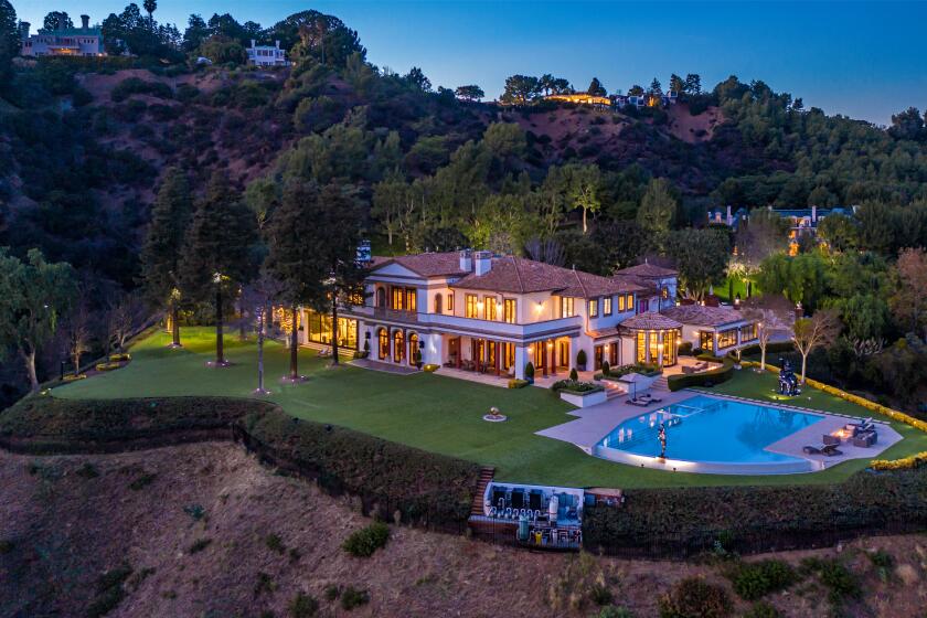The 21,000-square-foot home sits on 3.5 acres with views of the city below.