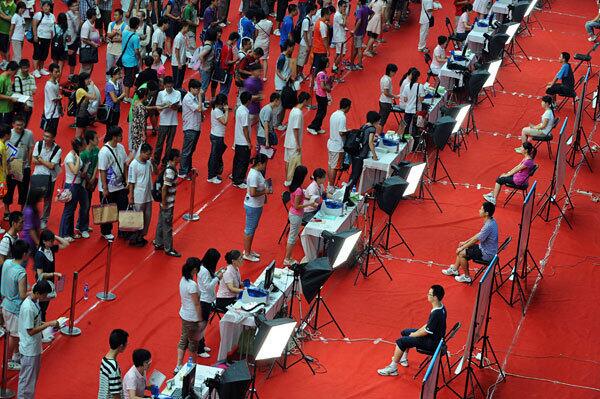 Chinese freshmen queue up to register as they arrive at the prestigious Tsinghua University. Ten million students took this year's college entrance exams, which help determine whether a student joins China's educated elite or the general work force.