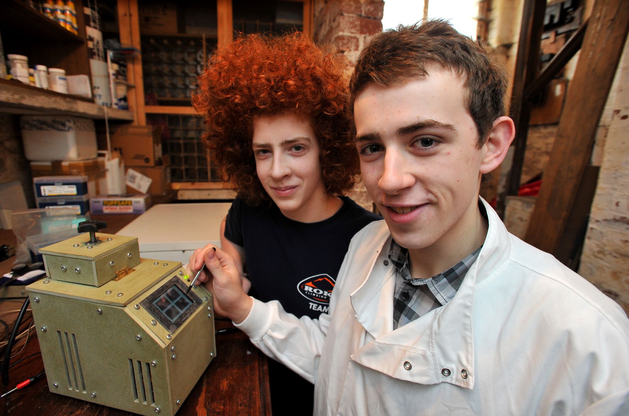 Fred Turner, at age 17, with his homemade PCR machine and his younger brother, Gus.