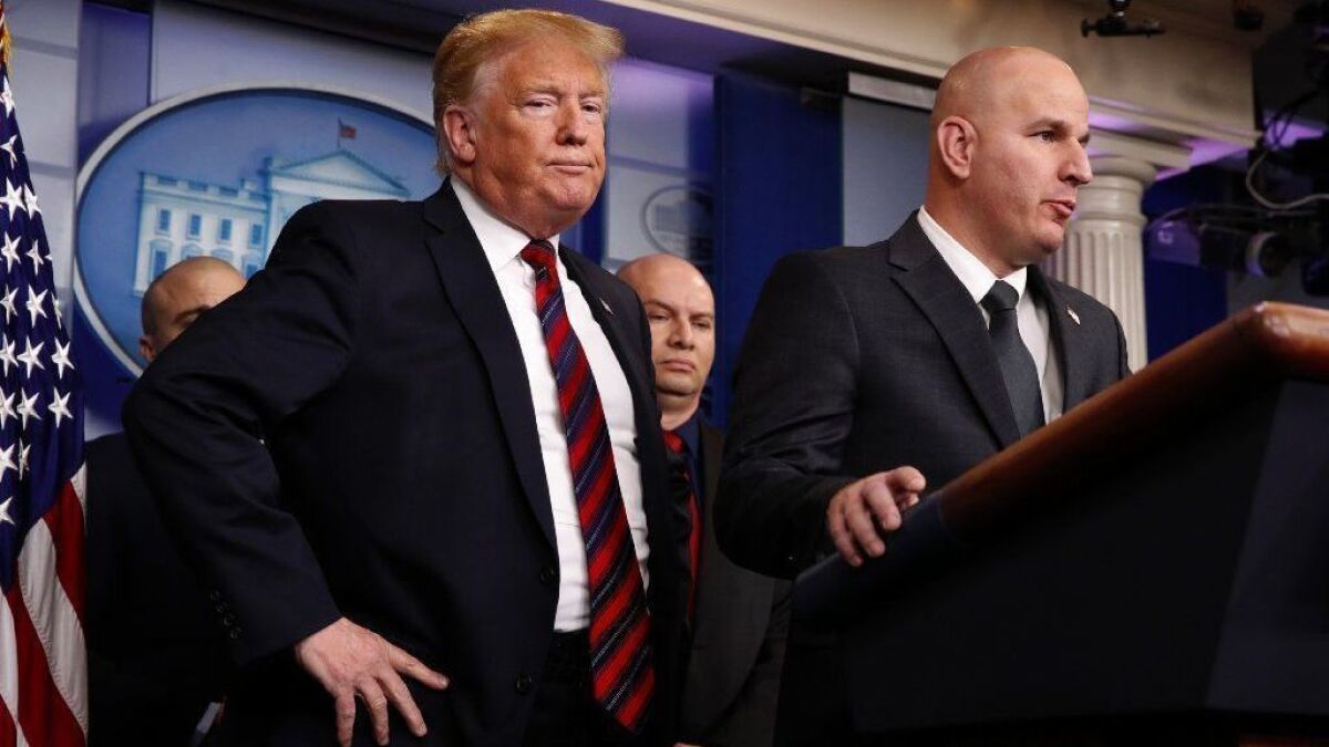 President Trump listens as Brandon Judd, president of the Border Patrol agents' union, speaks at the White House on Jan. 3.