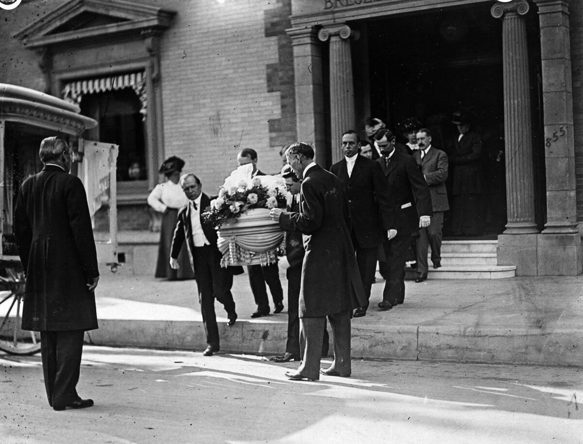 Oct. 5, 1910: At the funeral of night editor Churchill Harvey-Elder, the casket is taken from the funeral home. Harvey-Elder was not buried at Hollywood Forever Cemetery.