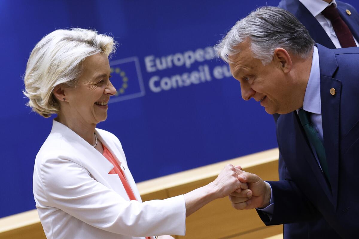 European Commission President Ursula von der Leyen, left, is greeted by Hungary's Prime Minister Viktor Orbán.