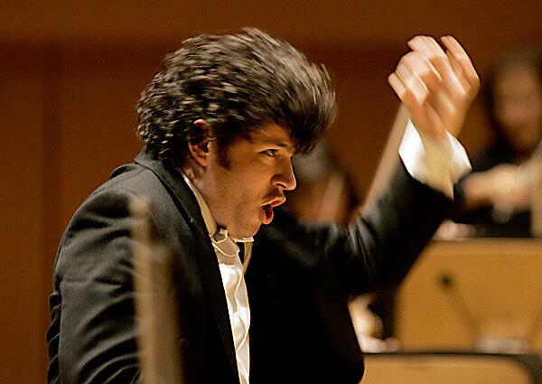 Gustavo Dudamel, the Los Angeles Philharmonic's new music director, displays his energetic style in conducting Mahler's First Symphony on Friday at Disney Concert Hall. Wrote Los Angeles Times music critic Mark Swed: "... In the Finale of Friday's Mahler, Dudamel missed no tricks and invented quite a few new ones. We're in for quite a ride."