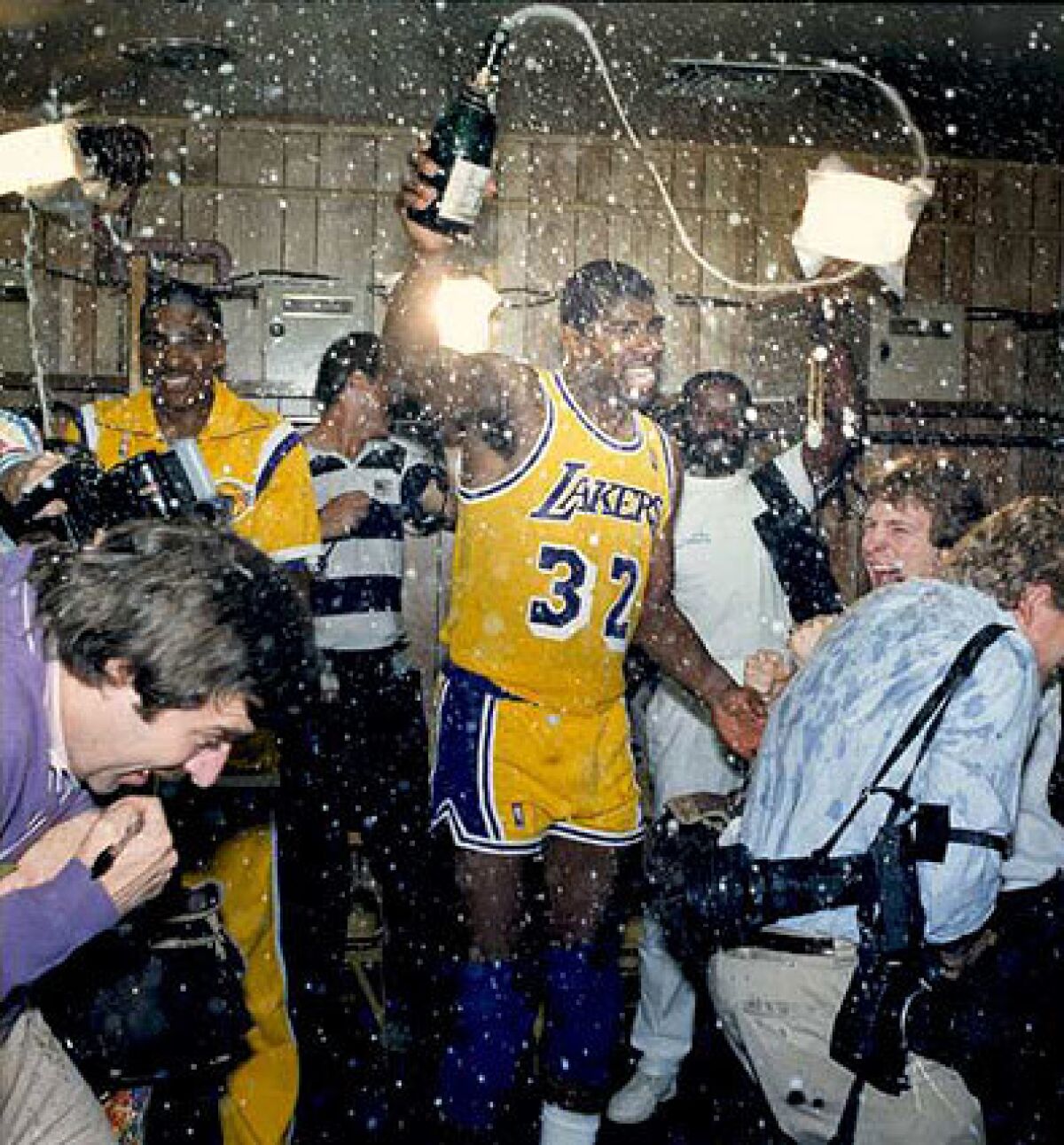 Magic Johnson and his Lakers teammates celebrate the series-clinching victory to the 1987 NBA Finals.