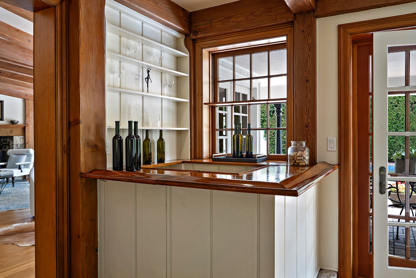 Features in the Country Colonial-style home include a built-in wet bar.