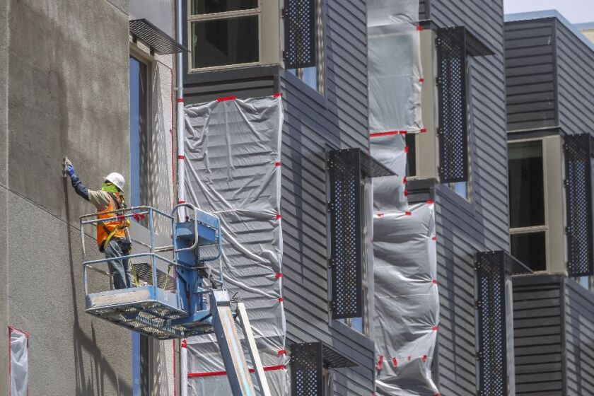 A construction worker works on The Stella, an 85-unit building for homeless veterans currently under construction in the Grantville neighborhood on Tuesday, June 11, 2019 in San Diego, California.