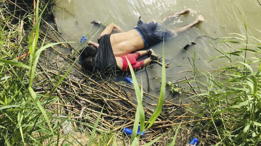 The bodies of Salvadoran migrant Oscar Alberto Martinez Ramirez and his nearly 2-year-old daughter, Valeria, lie on the bank of the Rio Grande in Matamoros, Mexico, on June 24, 2019.