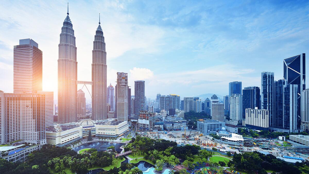 Kuala Lumpur at sunset. You can fly to Malaysia's capital for $470 on ANA.