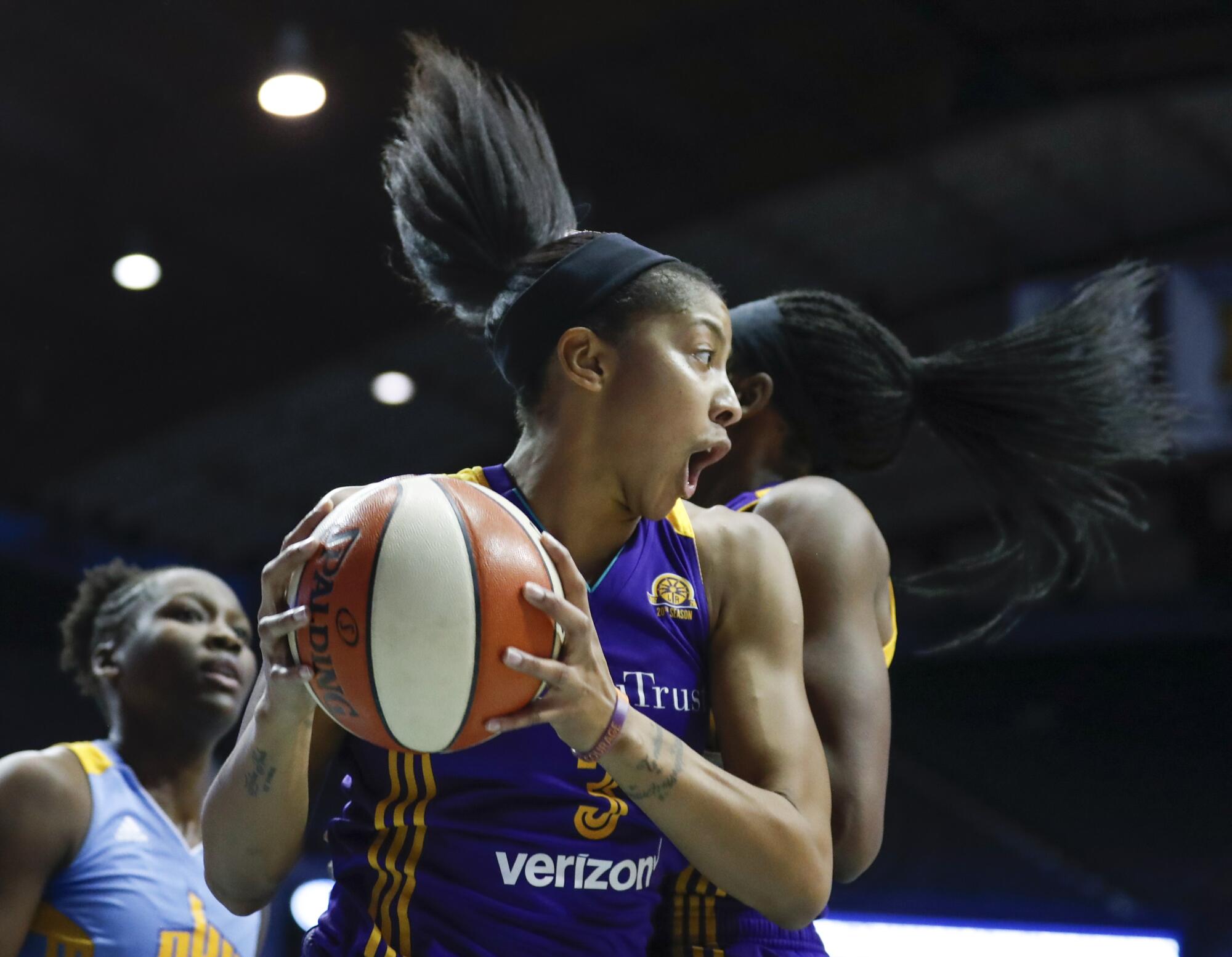 Sparks forward Candace Parker grabs a rebound against the Chicago Sky during the 2016 WNBA playoffs.