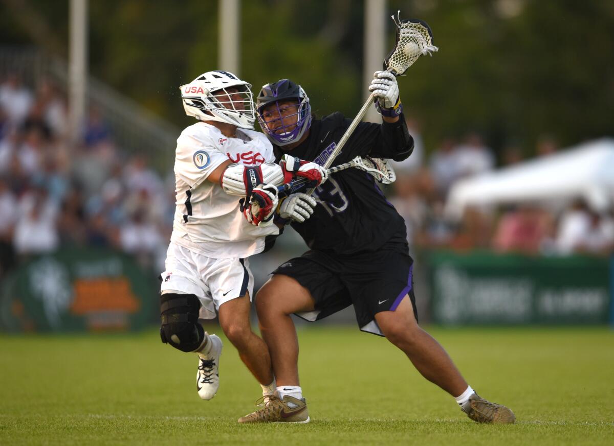 Limerick , Ireland - 13 August 2022; Efrain Barreto JR of Haudenosaunee is tackled by Danny Parker of USA during the 2022 World Lacrosse Men's U21 World Championship - Pool A match between USA and Haudenosaunee at University of Limerick. (Photo By Tom Beary/Sportsfile via Getty Images)
