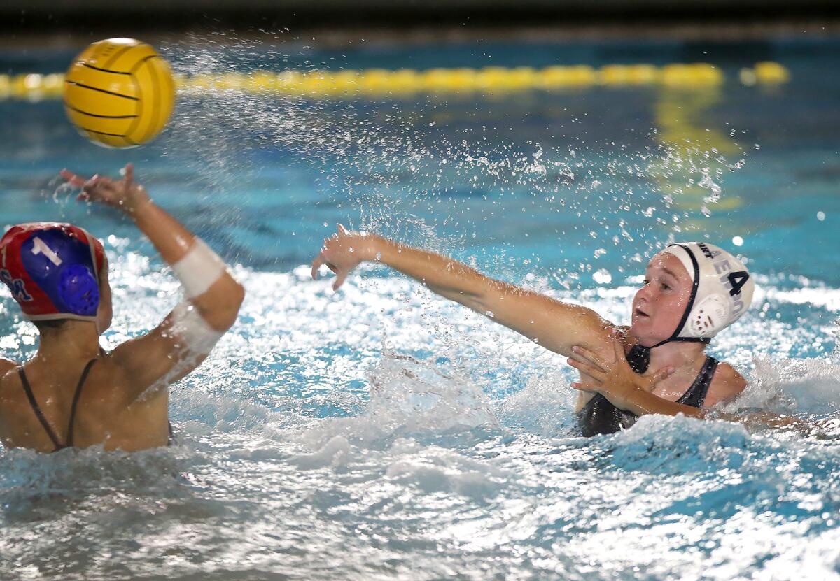 Newport Harbor’s Morgan Netherton (4) shoots high for a goal over Santa Margarita goalkeeper Isabella Rosensitto (1) during Thursday's CIF Southern Section Division 1 playoff opener at Saddleback College.
