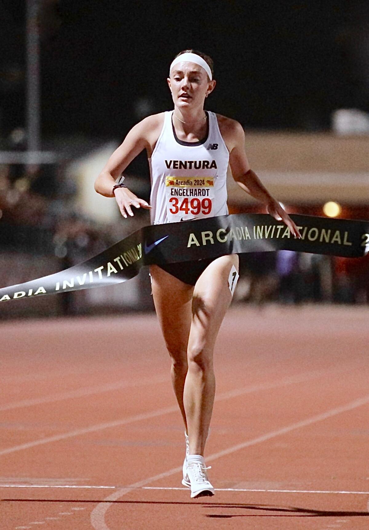Ventura's Sadie Engelhardt crosses the finish line and wins the girls' mile at the Arcadia Invitational.