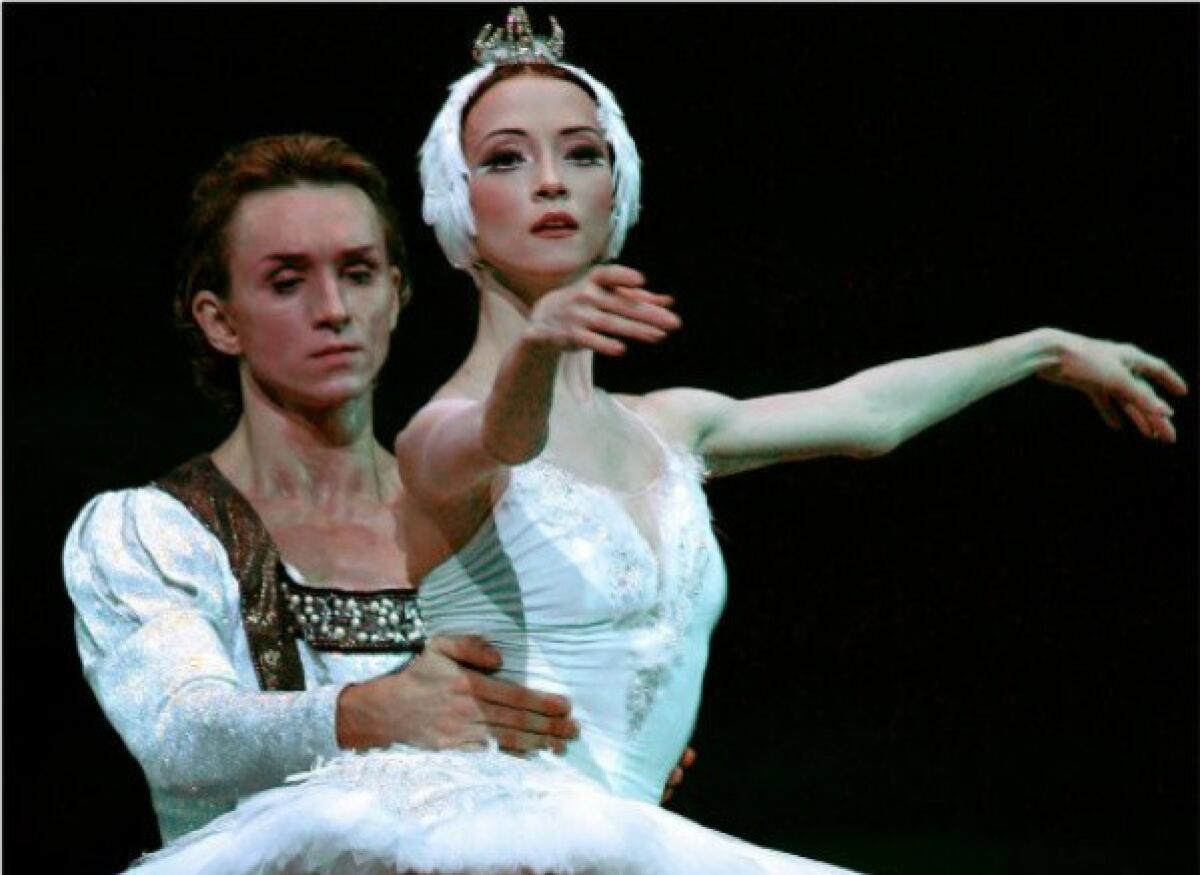 Bolshoi dancer Svetlana Lunkina, with Dmitri Gudanov, during a rehearsal of "Swan Lake" at the Royal Opera House in London in 2006.