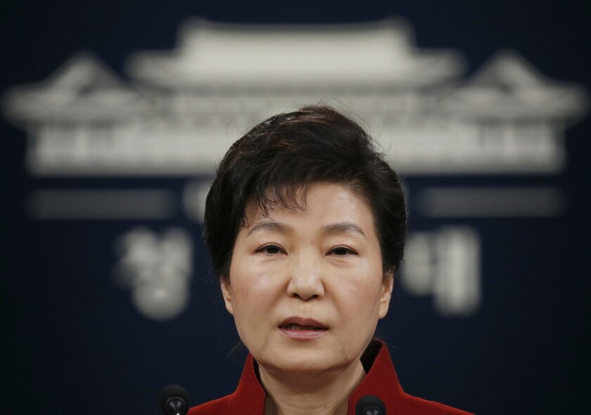 FILE - In this Jan. 13, 2016, file photo, South Korean President Park Geun-hye addresses the nation during her news conference at the Presidential Blue House in Seoul, South Korea. Upping its rhetoric a notch, North Korea warned Saturday, March 26, 2016, that it will attack Seoul’s presidential palace unless it receives an apology from South Korean President Park for “treason.” The warning is the latest threat against Washington and Seoul over joint U.S.-South Korean military drills now underway that the North sees as a dress rehearsal for invasion. (Kim Hong-ji/Pool Photo via AP, File)