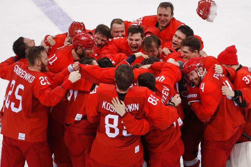 Olympic athletes from Russia celebrate after winning the men's gold medal hockey game against Germany, 4-3, in overtime at the 2018 Winter Olympics, Sunday, Feb. 25, 2018, in Gangneung, South Korea. (AP Photo/Jae C. Hong)