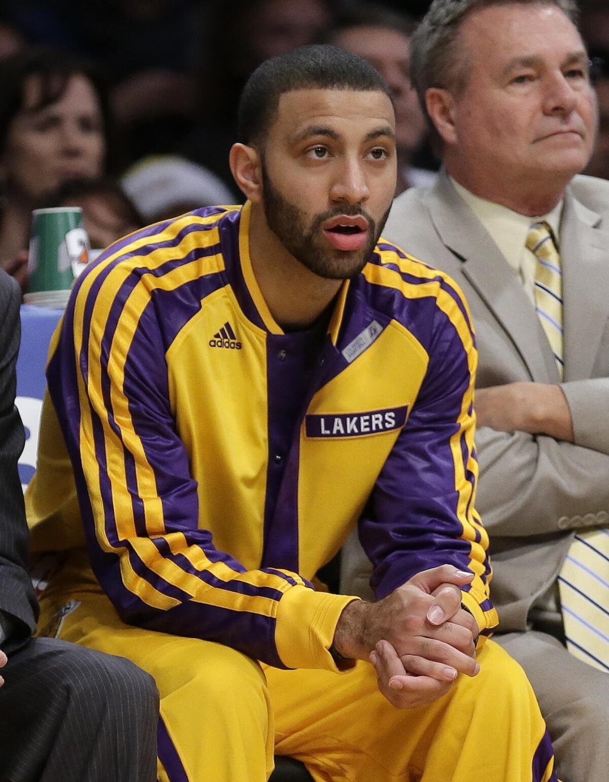 Newly acquired Lakers point guard Kendall Marshall watches from the bench during Friday's 104-91 win over the Minnesota Timberwolves.
