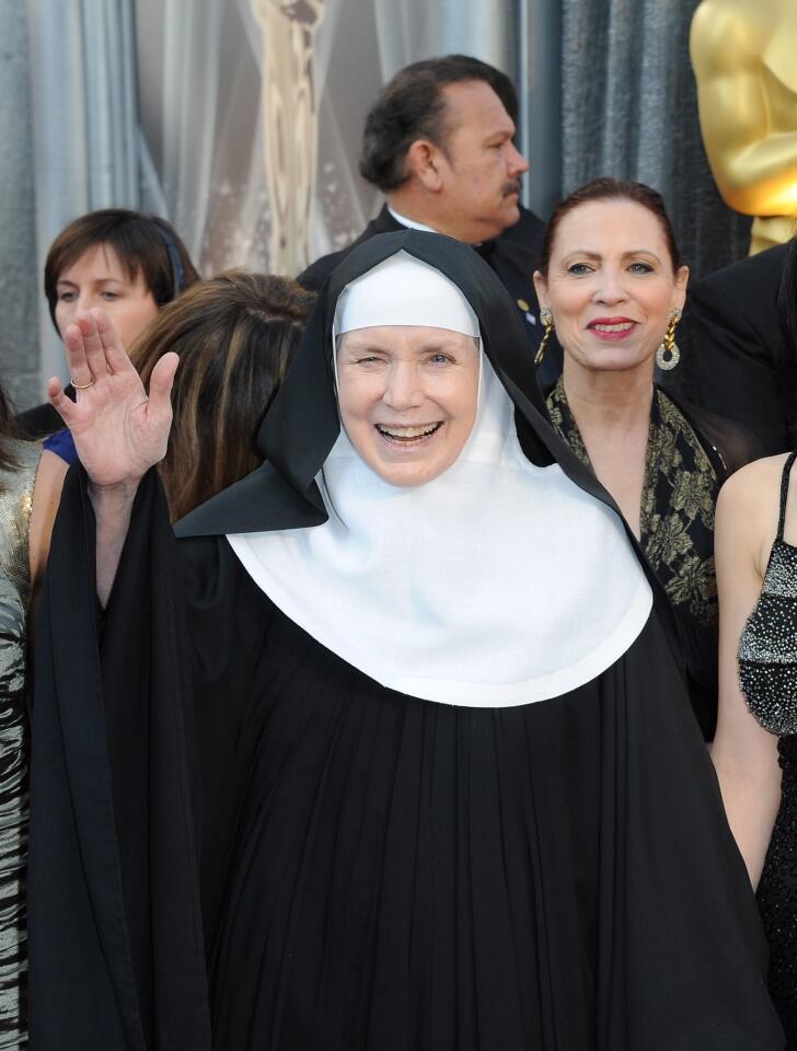 Mother Dolores Hart, featured in the Oscar-nominated documentary short "God is the Bigger Elvis," makes her way along the red carpet.