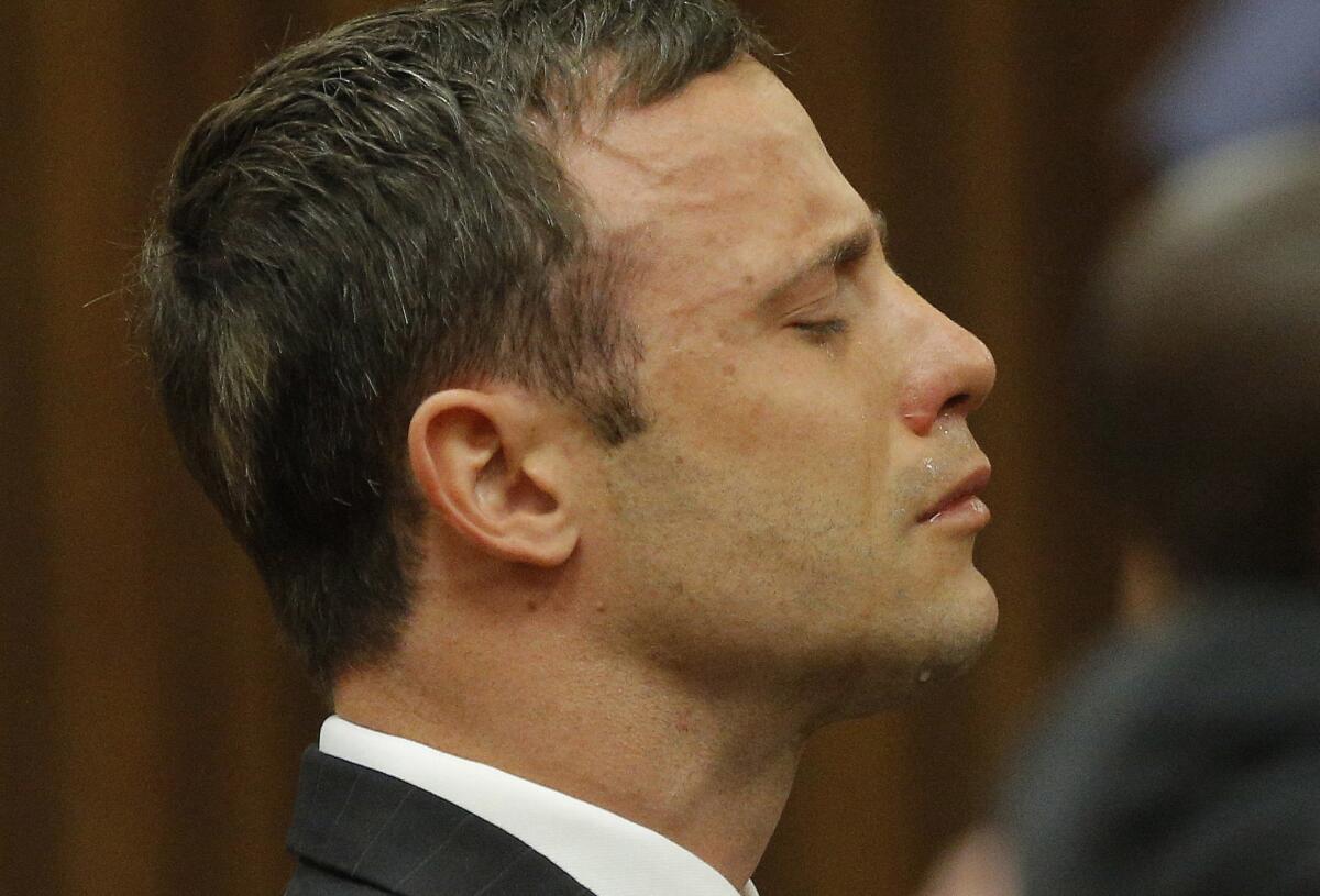 Oscar Pistorius reacts as the judge delivers the verdict during his murder trial in Pretoria, South Africa, on Sept. 11, 2014.