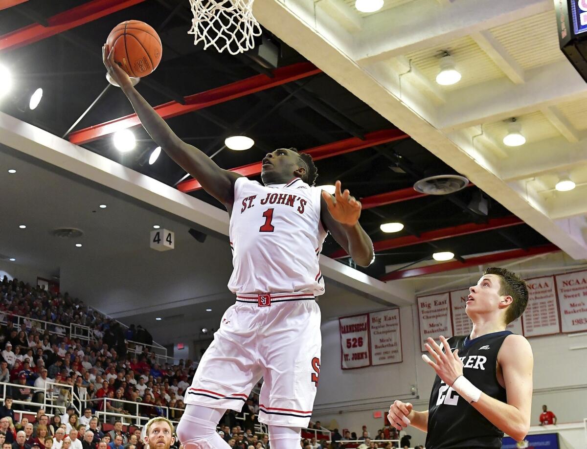 St. John's Bashir Ahmed (1) attempts a layup against Butler in a game in New York on Dec. 29.
