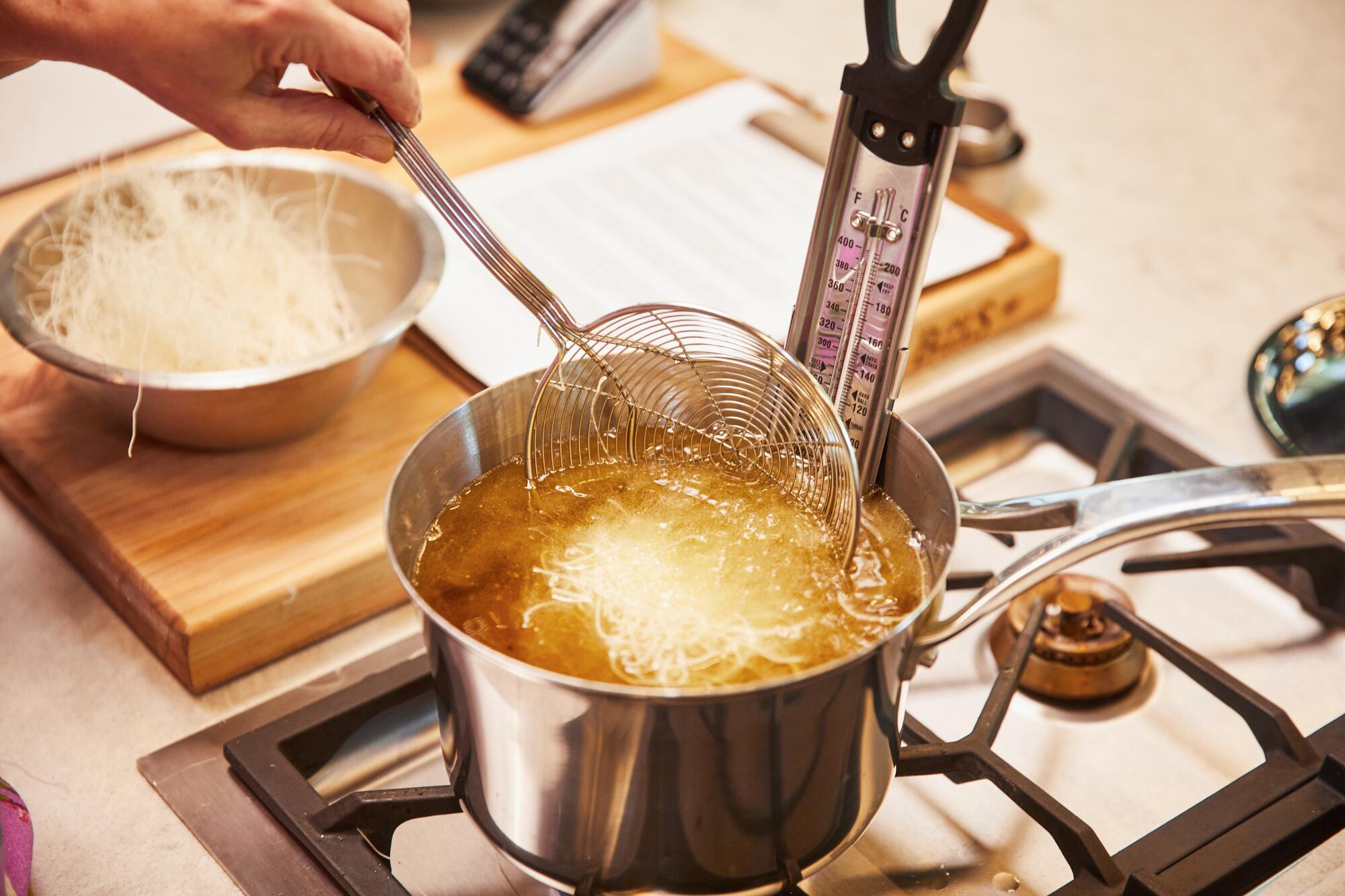 Preparation of vermicelli noodles for the fried shrimp, made at the LA Times Test Kitchen in El Segundo. 