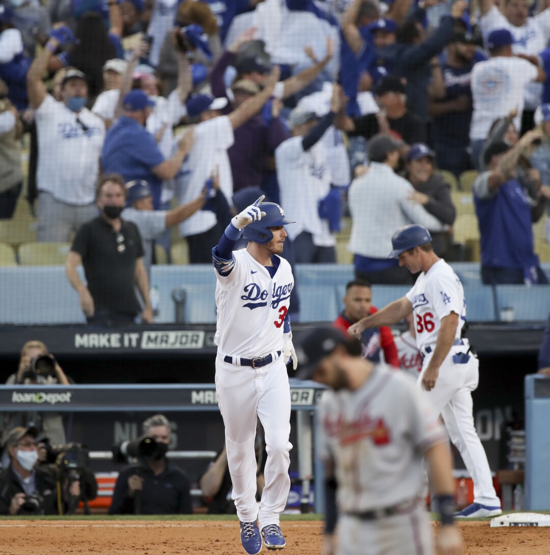 Bellinger celebrates after hitting a game-tying three-run home run.