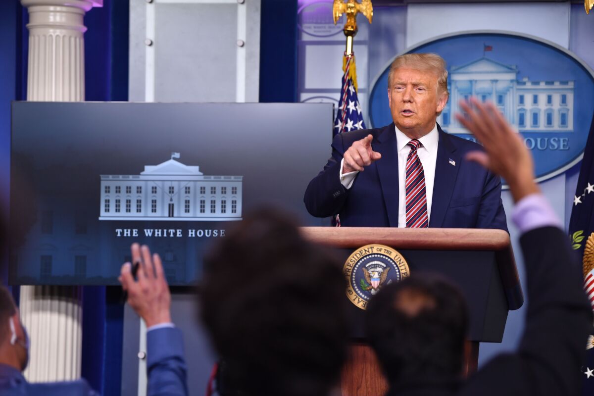 President Trump answers questions during a news conference in the White House Aug. 12. 