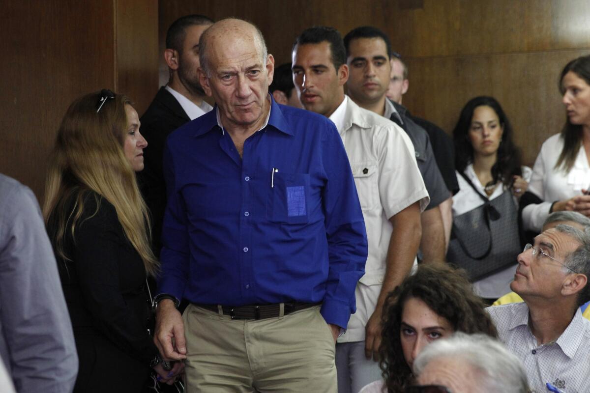 Ehud Olmert stands at the Tel Aviv District Court on May 13, 2014.
