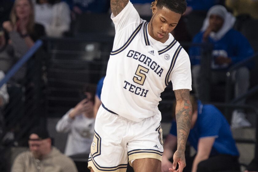 Georgia Tech guard Deivon Smith reacts after making a three pointer in the first half of an NCAA college basketball game against Duke, Saturday, Jan 28, 2023, in Atlanta. (AP Photo/Hakim Wright Sr.)