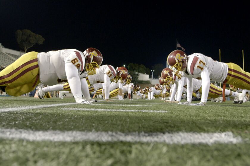 Roosevelt players warm up before playing Garfield in the East L.A. Classic featured in the documentary "The All-Americans."