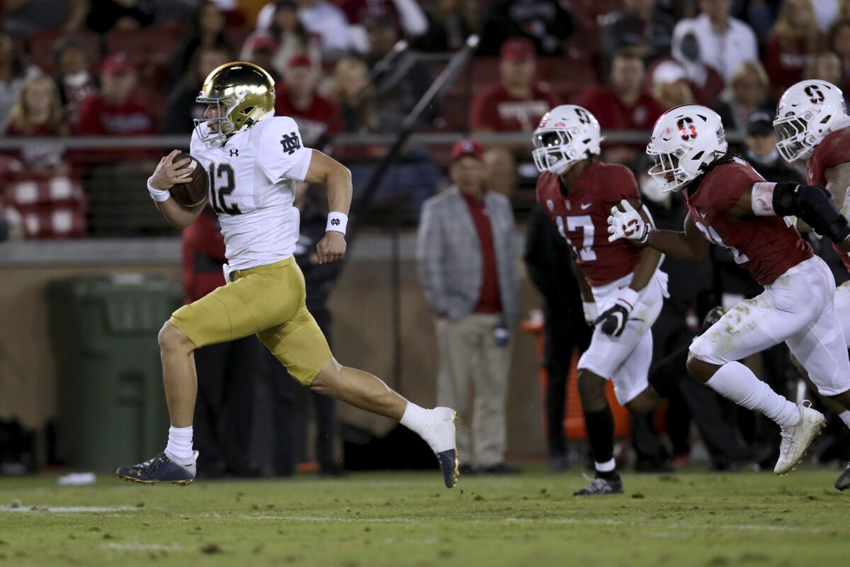 Notre Dame's Tyler Buchner runs for a touchdown against Stanford on Nov. 27, 2021.