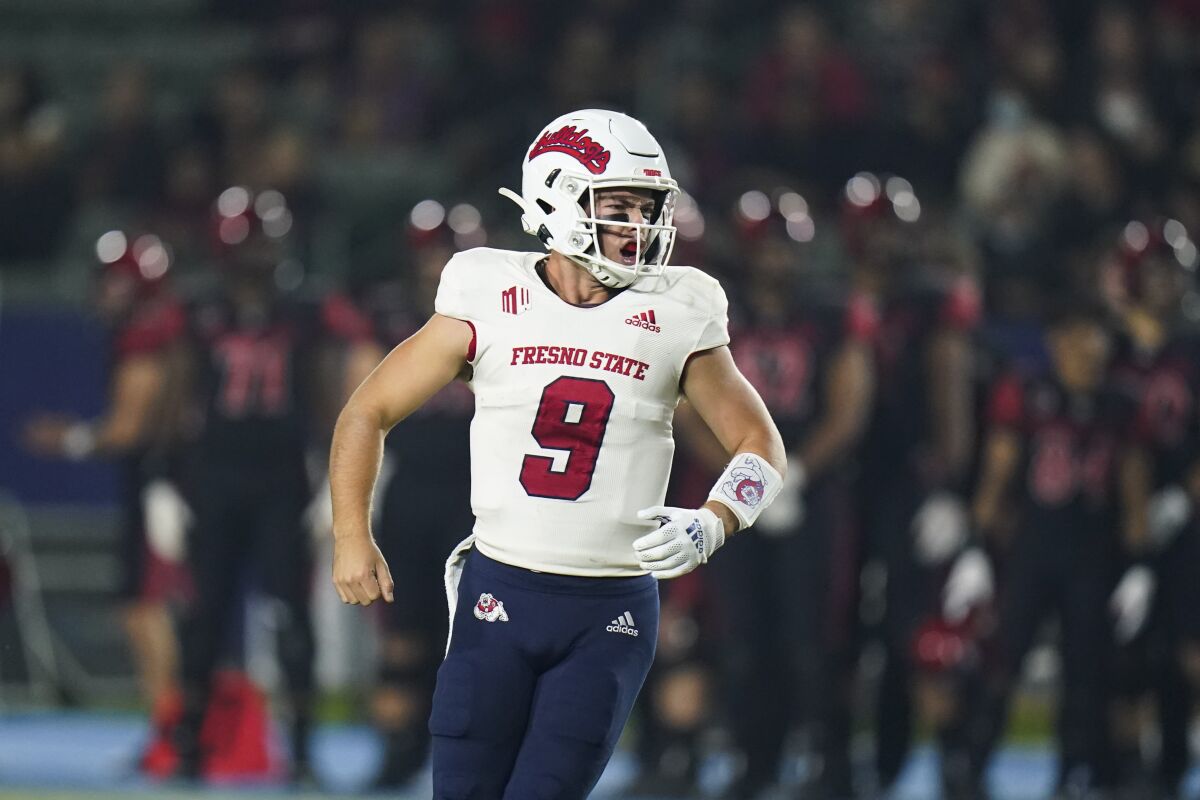 Fresno State quarterback Jake Haener celebrates after throwing a touchdown pass during the first half of an NCAA college football game against San Diego State on Saturday, Oct. 30, 2021, in Carson, Calif. (AP Photo/Jae C. Hong)