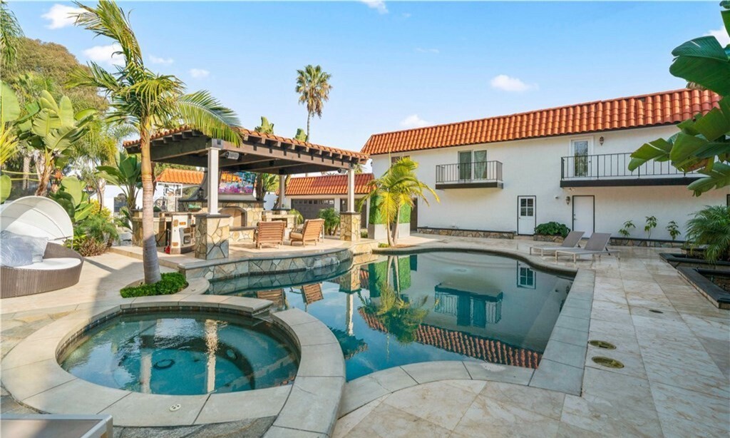 Perched atop a bluff, the Spanish-style home overlooks the ocean from decks, patios, balconies and lawns.