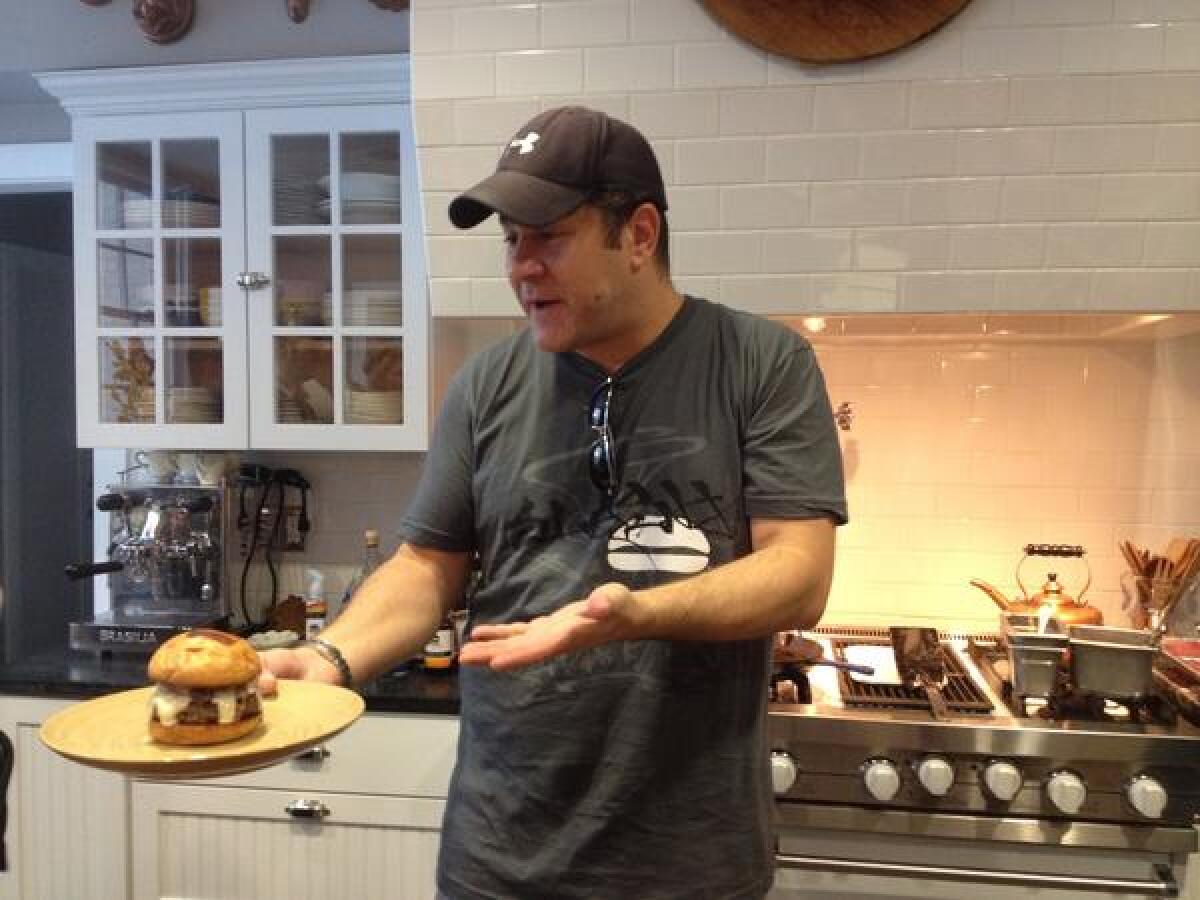 Adam Fleischman, founder of Umami Burger, hosts a burger-making demo at his Los Angeles home for members of social club Truffl.