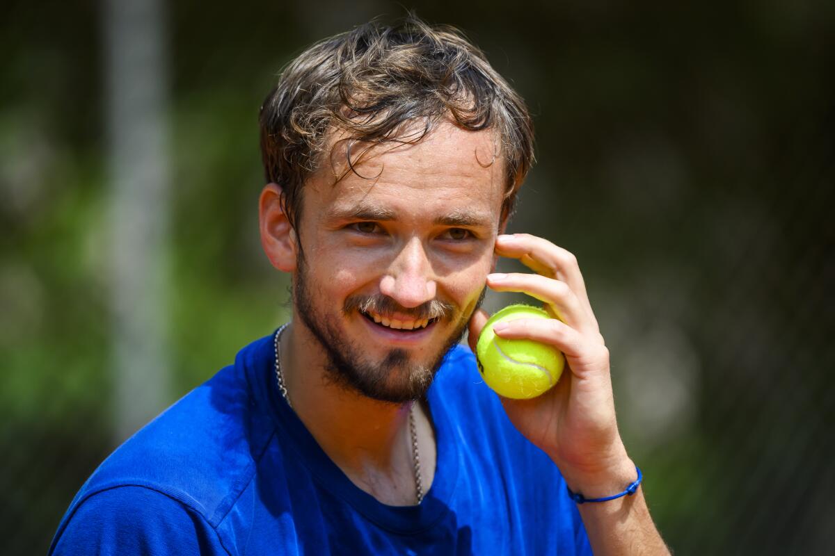 Daniil Medvedev, tennis player from Russia, reacts during a training session at the ATP 250 Geneva Open tennis tournament in Geneva, Switzerland, Sunday, May 15, 2022. (Jean-Christophe Bott/Keystone via AP)