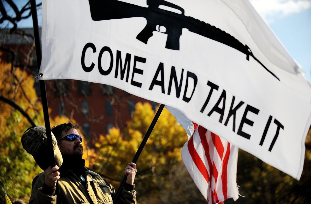 A gun rights activist protests outside the White House in November.
