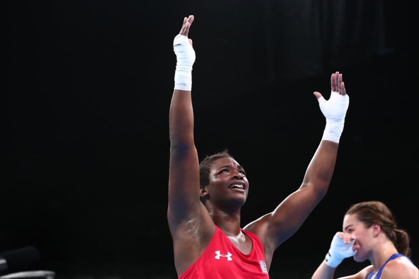 Claressa Shield celebrates after beating Nouchka Fontijn, of the Netherlands, in the Women's Middleweight Final.