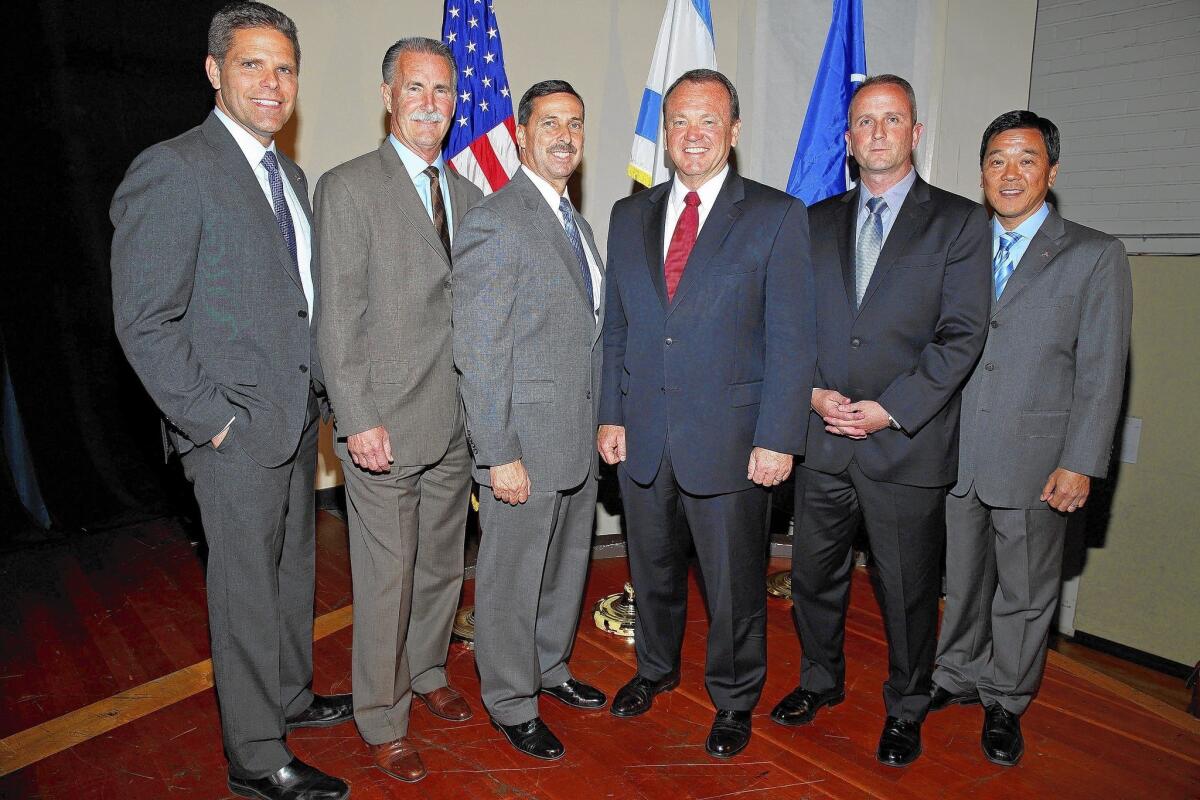 Six of the seven candidates for Los Angeles County Sheriff, from left: James Hellmold, Bob Olmsted, Todd Rogers, Jim McDonnell, Lou Vince and Paul Tanaka.