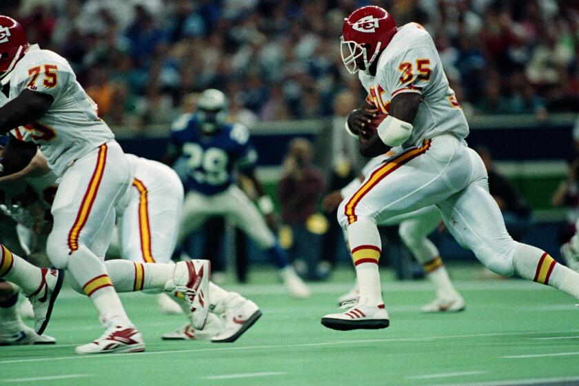Kansas City Chiefs' running back Christian Okoye (35) makes it to 156 yards, Oct. 9, 1989, in their game against Seattle.