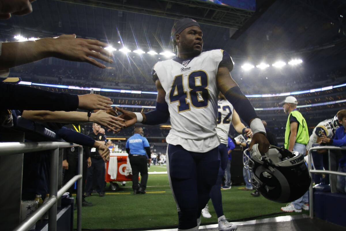 Rams linebacker Travin Howard (48) walks off the field after a game in 2019.