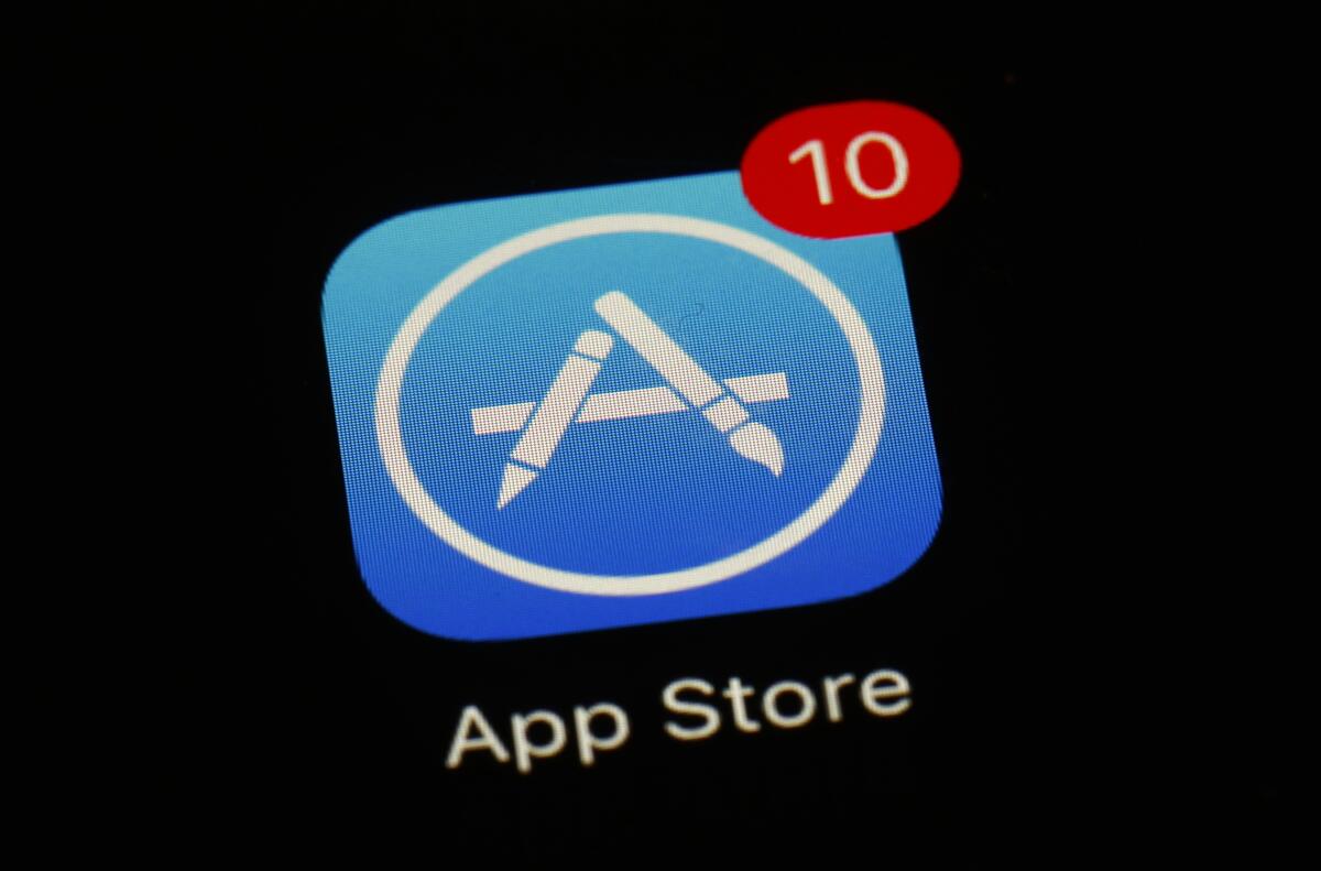 This March 19, 2018, file photo shows Apple's App Store app logo on a smartphone screen.