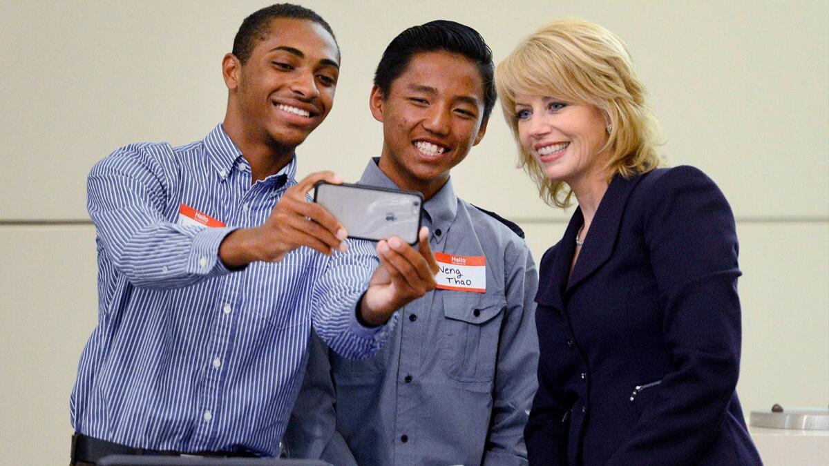 Fresno Mayor Ashley Swearengin poses for a selfie with Youth Commission appointees Jason Phillips, left, and Neng Thao in April 2016. (Fresno Bee)