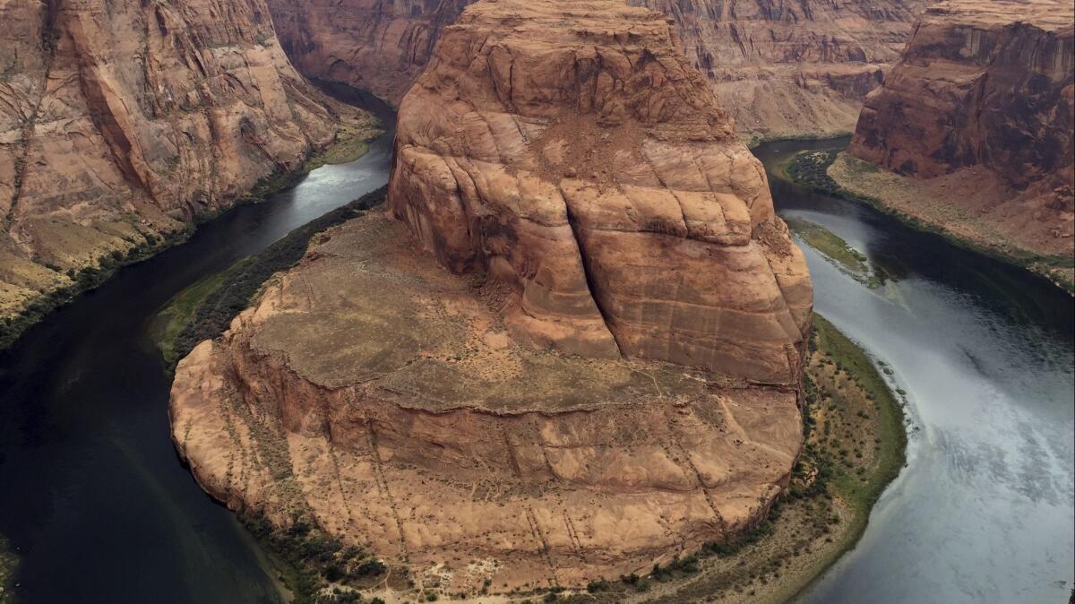 This Aug. 27, 2016, photo shows Horseshoe Bend near Page, Ariz. Authorities say a California teen visiting the Arizona landmark has died from what appears to be an accidental fall.