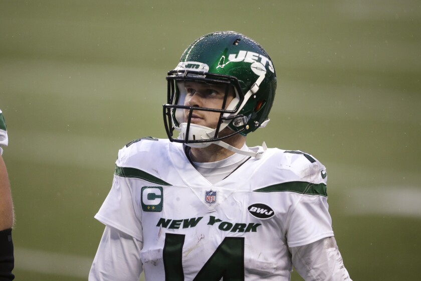 New York Jets quarterback Sam Darnold walks off the field after the team lost to the Seattle Seahawks in an NFL football game, Sunday, Dec. 13, 2020, in Seattle. (AP Photo/Lindsey Wasson)