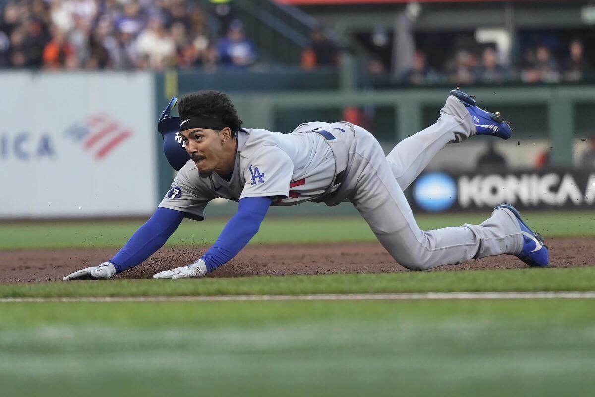 Dodgers' Miguel Vargas steals third base during the second inning against the San Francisco Giants.