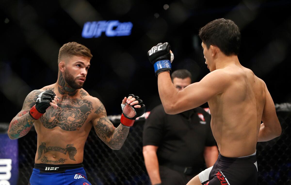 Cody Garbrandt, left, and Takeya Mizugaki square off during their bantamweight fight at UFC 202.