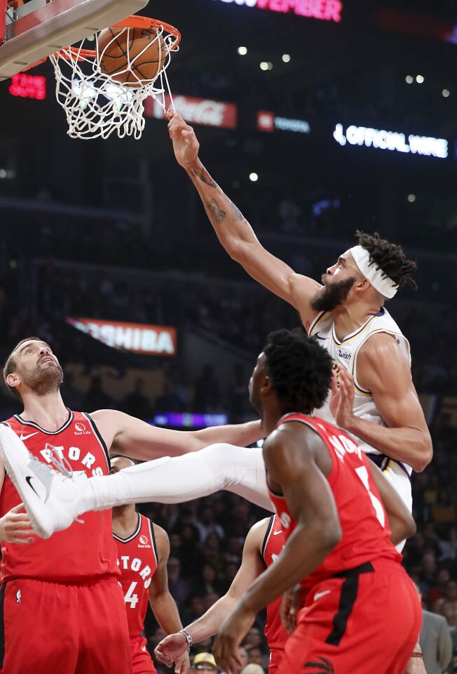 Lakers center JaVale McGee throws down a dunk against the Raptors during the first half.