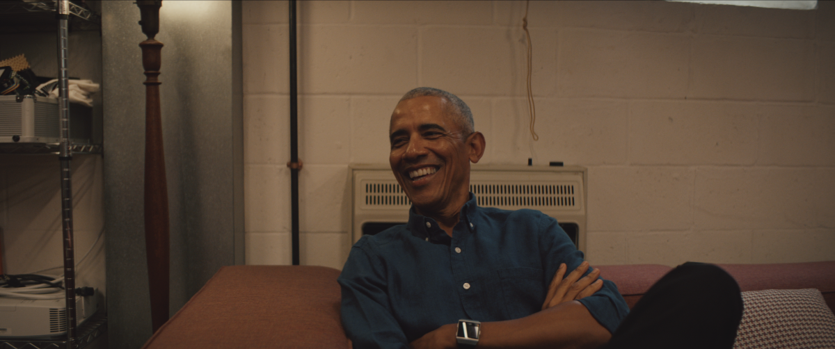 Barack Obama sitting in a supply closet