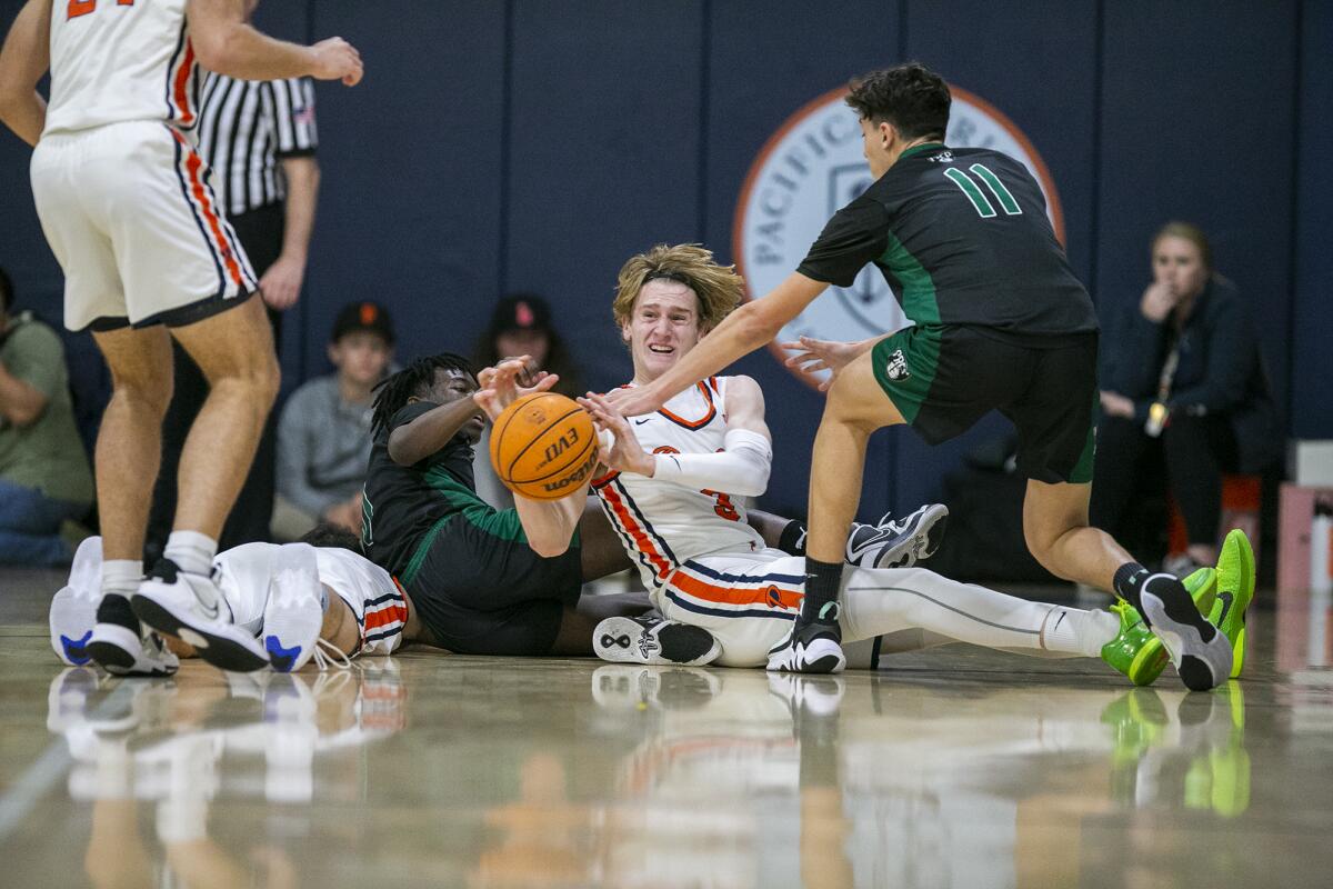 Pacifica Christian Orange County's Parker Strauss battles for a loose ball against Fairmont Prep's Oliver Jones on Friday.