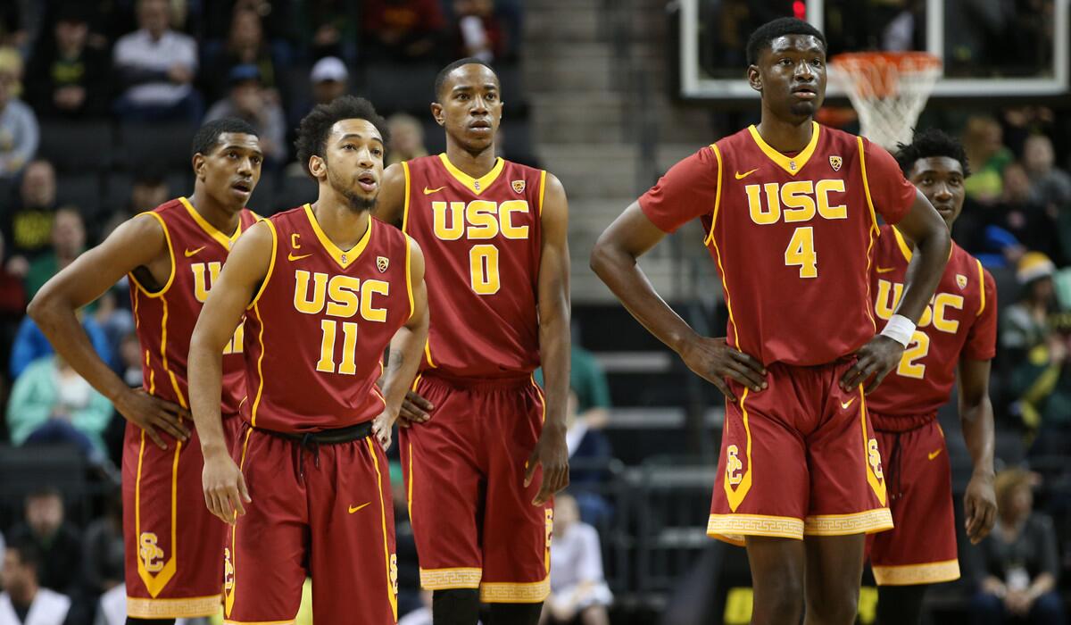 The Trojans, including Jordan McLaughlin (11) and Chimezie Metu (4), take the court for a game earlier this season.