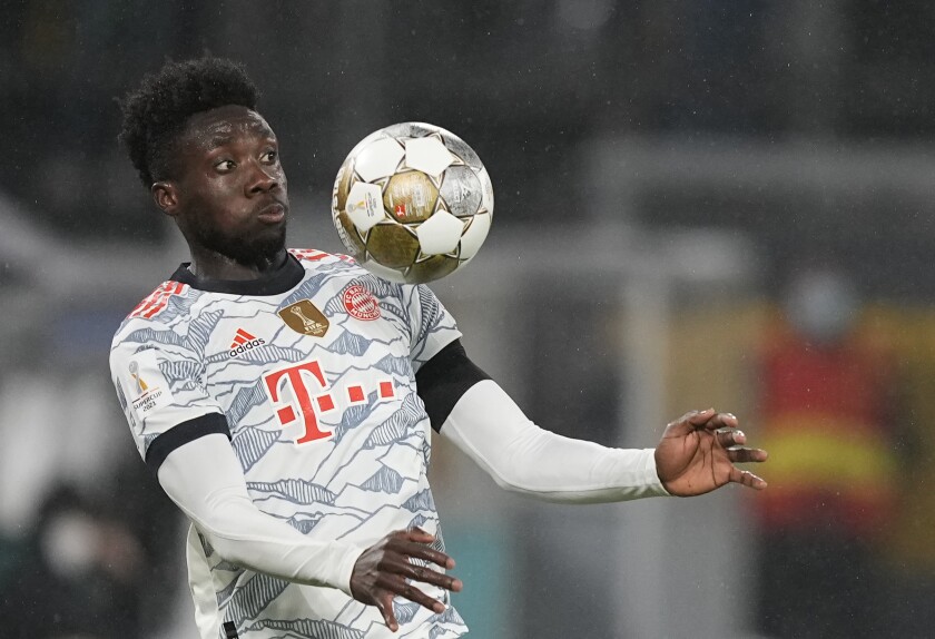 Bayern's Alphonso Davies controls the ball during a German Super Cup game against Borussia Dortmund 